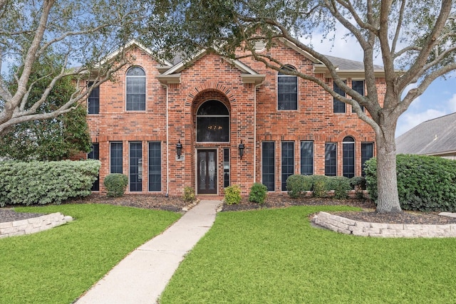 view of front of home featuring a front lawn