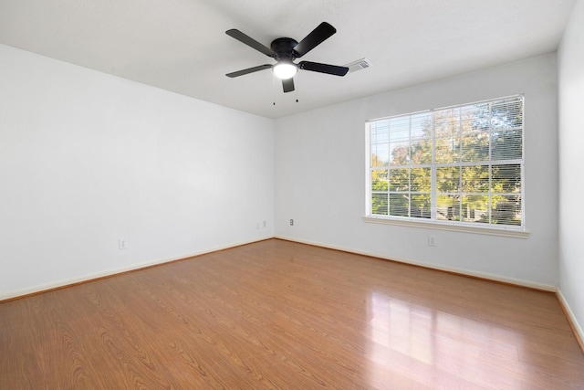 unfurnished room featuring ceiling fan and light hardwood / wood-style flooring