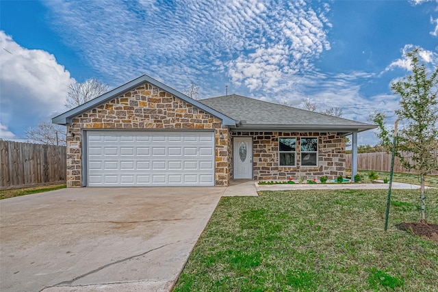 view of front of property with a front lawn and a garage