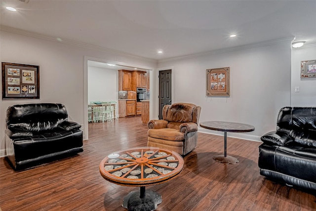 living room with light hardwood / wood-style floors and ornamental molding