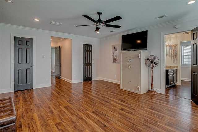 unfurnished living room with crown molding, wood-type flooring, and ceiling fan