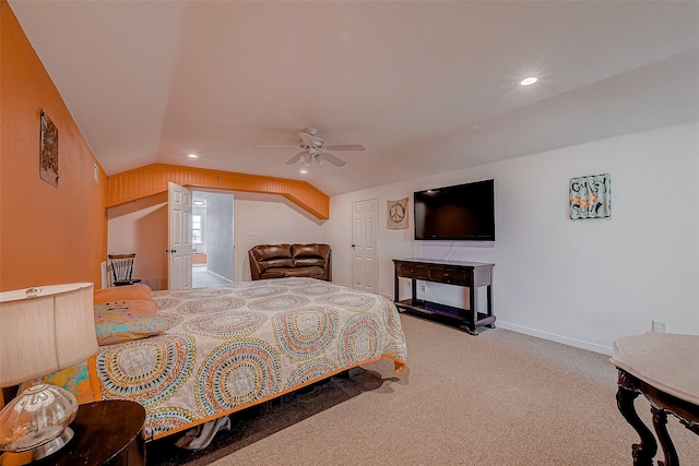 carpeted bedroom featuring vaulted ceiling and ceiling fan