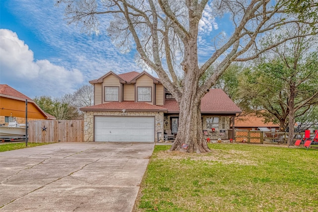 view of front of house with a front yard, stone siding, fence, and concrete driveway