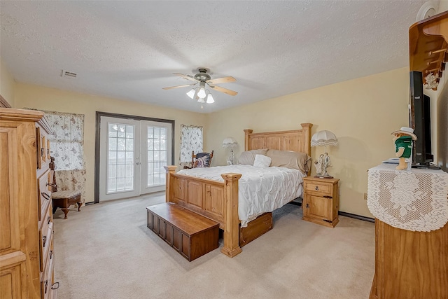 bedroom featuring access to exterior, light carpet, ceiling fan, and visible vents