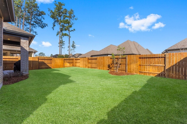 view of yard featuring a fenced backyard