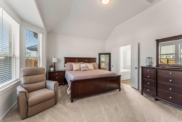 bedroom with light carpet, high vaulted ceiling, ensuite bath, and visible vents