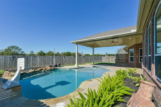 view of pool featuring a fenced in pool, a patio, a ceiling fan, an in ground hot tub, and a fenced backyard