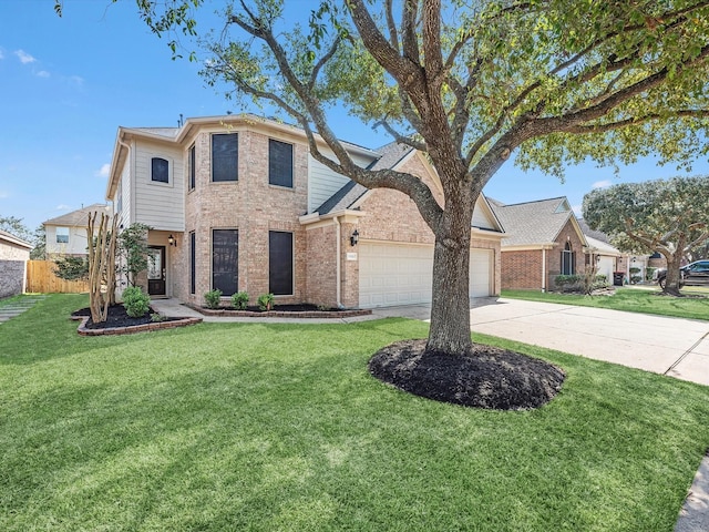 traditional-style home featuring fence, driveway, an attached garage, a front lawn, and brick siding