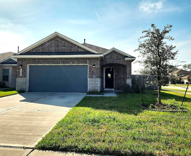 view of front facade with a garage and a front yard