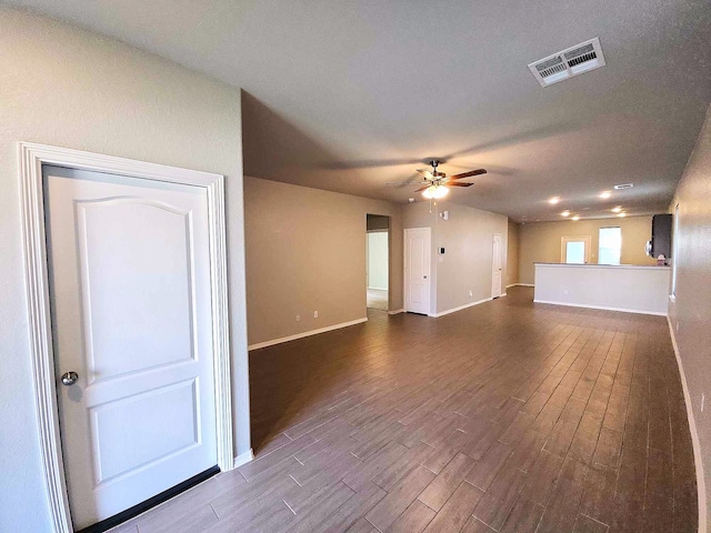 24827 Colony Meadow Trl, Houston, TX 77336 - unfurnished living room with ceiling fan, dark wood-style floors, and baseboards