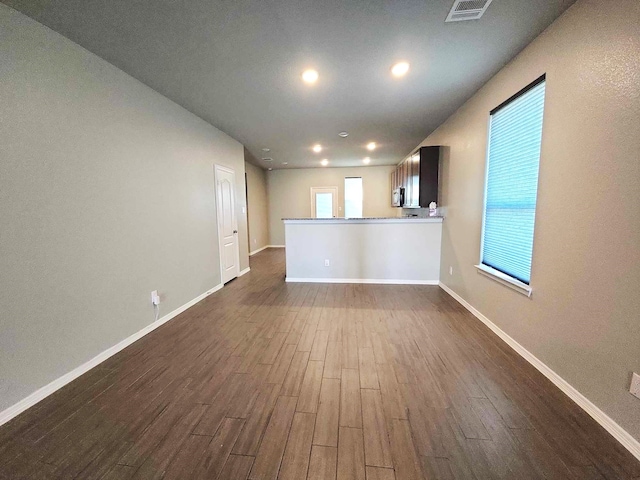24827 Colony Meadow Trl, Houston, TX 77336 - unfurnished living room featuring dark wood-style floors, baseboards, and recessed lighting