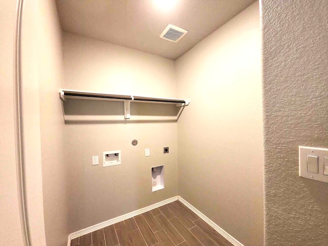 24827 Colony Meadow Trl, Houston, TX 77336 - laundry area with electric dryer hookup, baseboards, gas dryer hookup, hookup for a washing machine, and dark wood-style floors