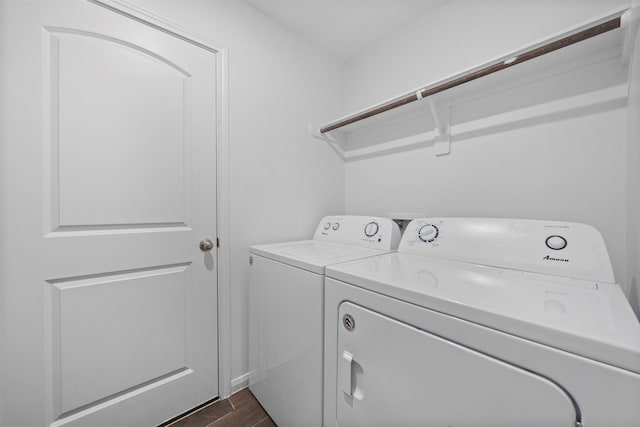 washroom featuring washer and dryer and dark wood-type flooring