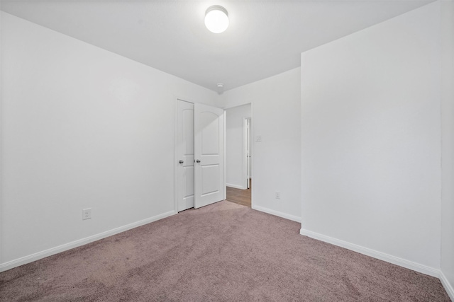 spare room with light carpet