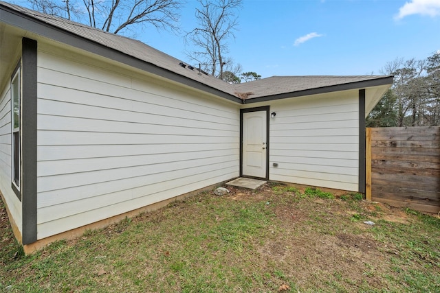 rear view of property with a yard