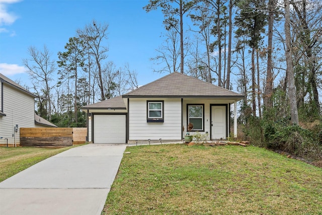 view of front of house featuring a front yard and a garage