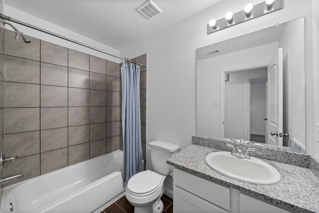 full bathroom with vanity, toilet, and shower / bath combo with shower curtain