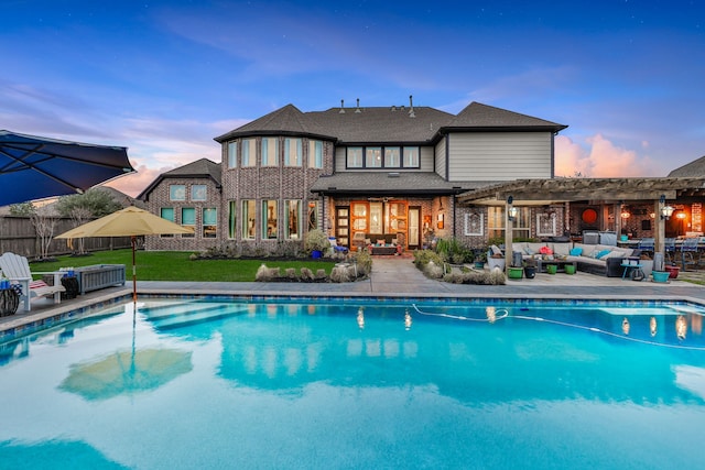 outdoor pool with a lawn, fence, a patio area, an outdoor living space, and a pergola