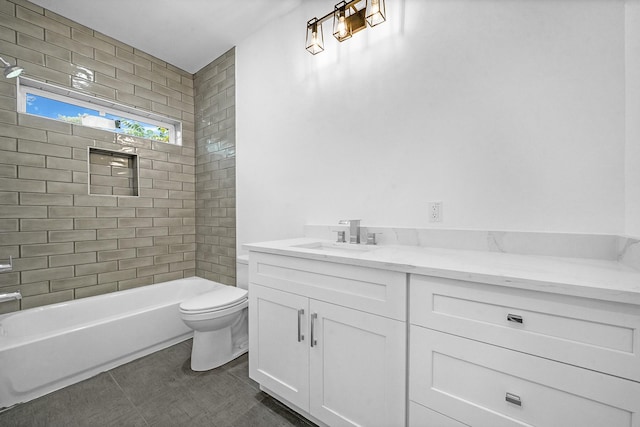 full bathroom with tile patterned floors, vanity, toilet, and tiled shower / bath