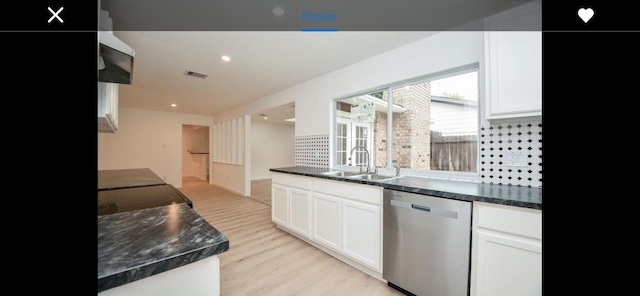 kitchen featuring sink, white cabinetry, light hardwood / wood-style floors, and dishwasher