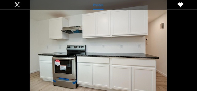 kitchen with electric stove, white cabinetry, and light hardwood / wood-style flooring