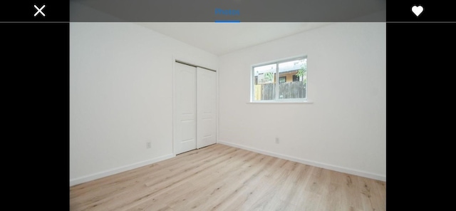 unfurnished room with light hardwood / wood-style floors