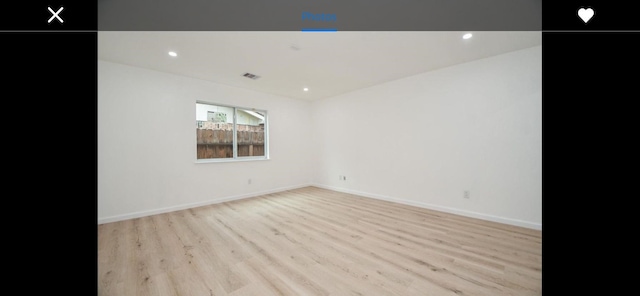 unfurnished room featuring light wood-type flooring