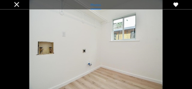 laundry area with light wood-type flooring, electric dryer hookup, and hookup for a washing machine