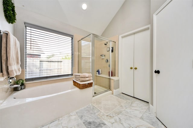 full bath with lofted ceiling, a stall shower, marble finish floor, and a bath