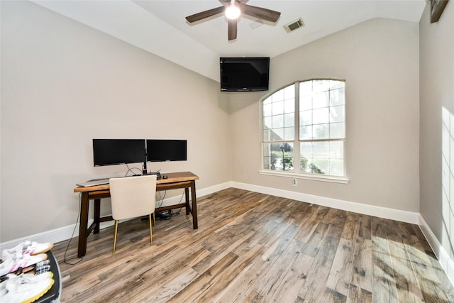 office area featuring lofted ceiling, wood finished floors, a ceiling fan, visible vents, and baseboards