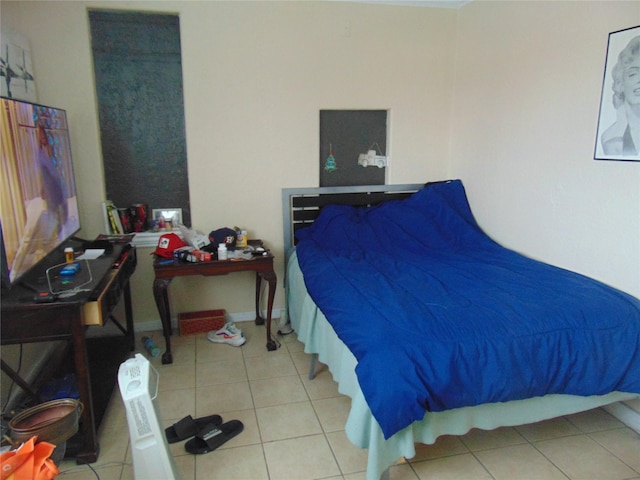 bedroom featuring light tile patterned floors