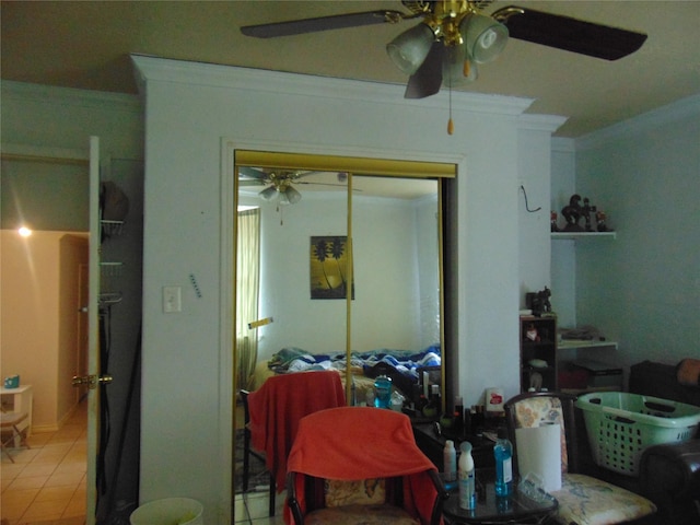 interior space with a closet, crown molding, and ceiling fan