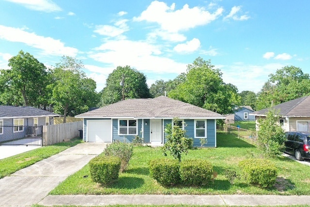 ranch-style home featuring a garage and a front lawn