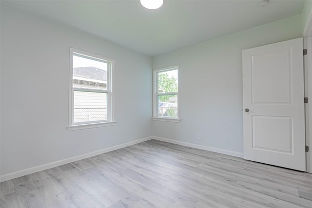 unfurnished room featuring light wood-type flooring