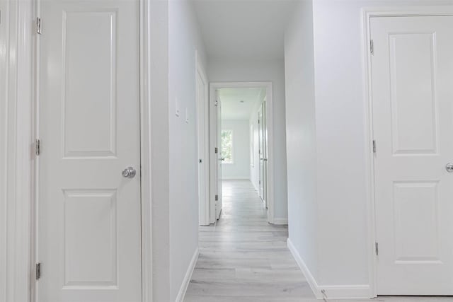 hall with light wood-type flooring