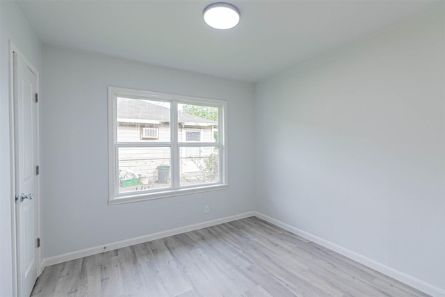 empty room with light hardwood / wood-style flooring