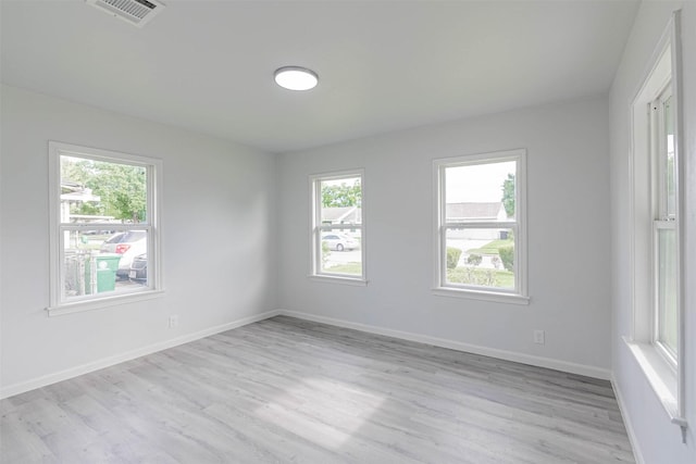 spare room with light wood-type flooring