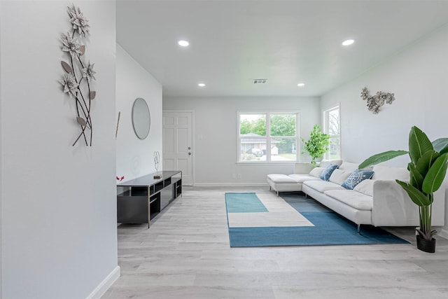 living room with light hardwood / wood-style floors