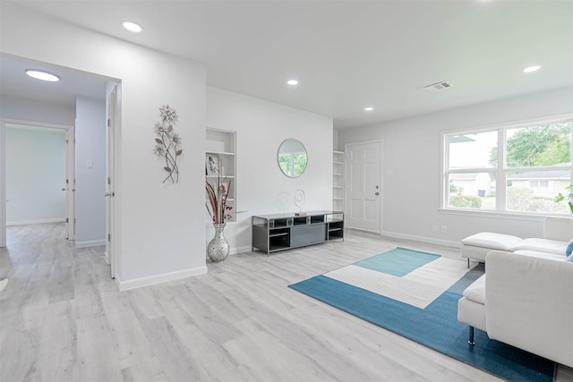 living room with light hardwood / wood-style floors