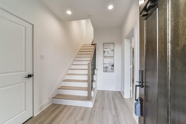 515 Egan St, Houston, TX 77020 - stairway featuring wood finished floors, baseboards, and recessed lighting