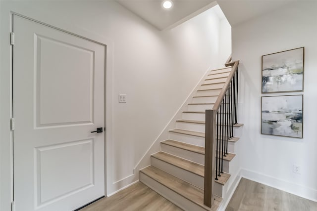 515 Egan St, Houston, TX 77020 - stairway with wood finished floors, baseboards, and recessed lighting