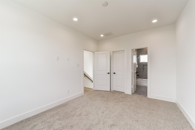 515 Egan St, Houston, TX 77020 - unfurnished bedroom featuring carpet flooring, recessed lighting, baseboards, and ensuite bath