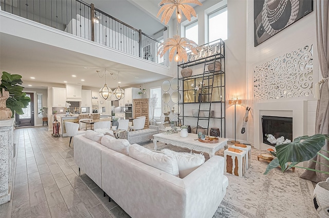 living room featuring hardwood / wood-style floors and an inviting chandelier