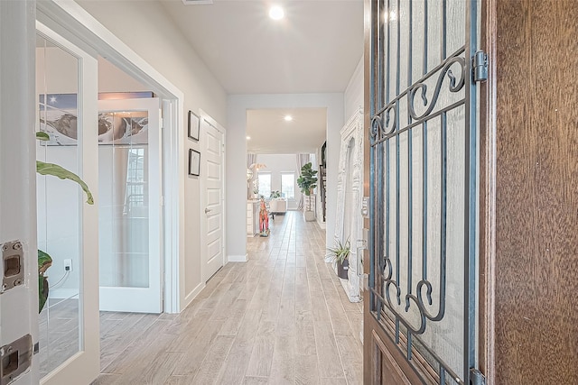 entrance foyer featuring light wood-type flooring and french doors