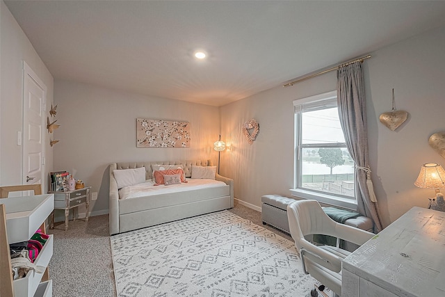 bedroom featuring light colored carpet