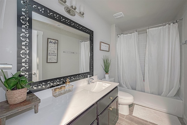 full bathroom featuring vanity, toilet, and shower / bathtub combination with curtain