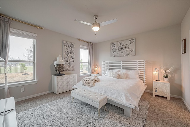 bedroom with ceiling fan and carpet floors