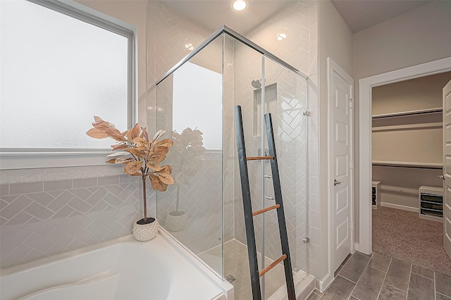 bathroom with separate shower and tub