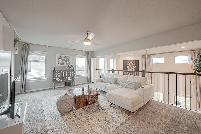 living room featuring ceiling fan and light colored carpet