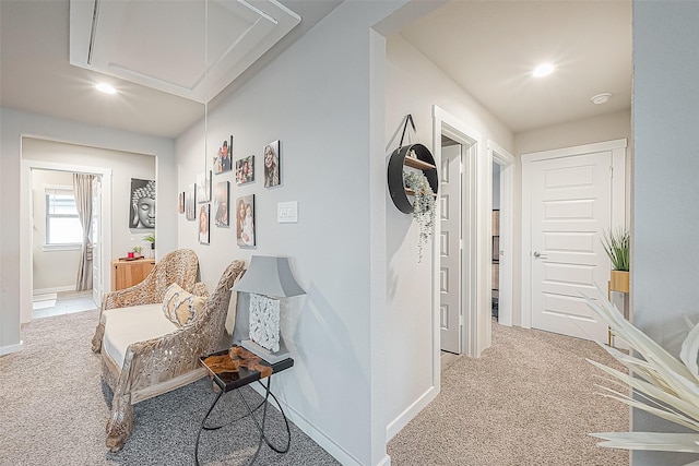 hallway with light colored carpet